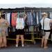 Shoppers browse through the racks of clothing in front of Urban Outfitters during the State St. Art Fair on Wednesday, July 17, 2013. Melanie Maxwell | AnnArbor.com